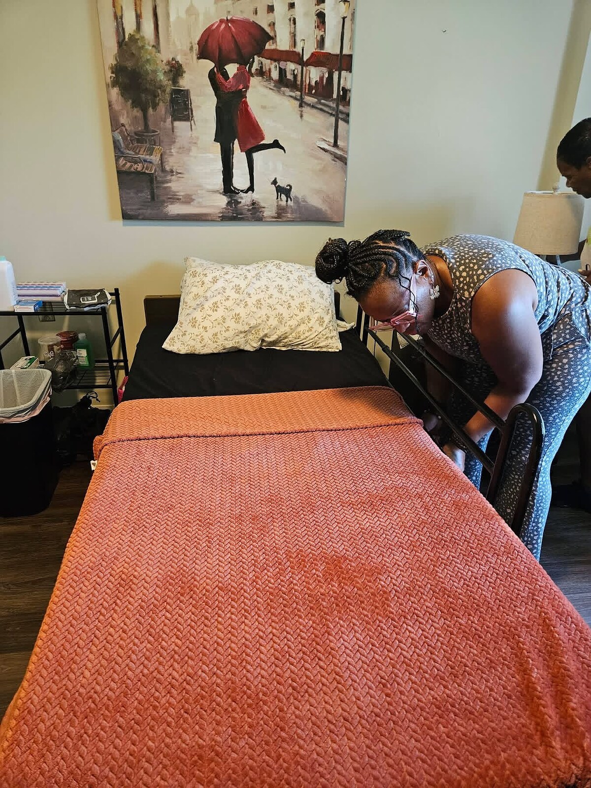A Women’s Ministry volunteer preparing a bedroom