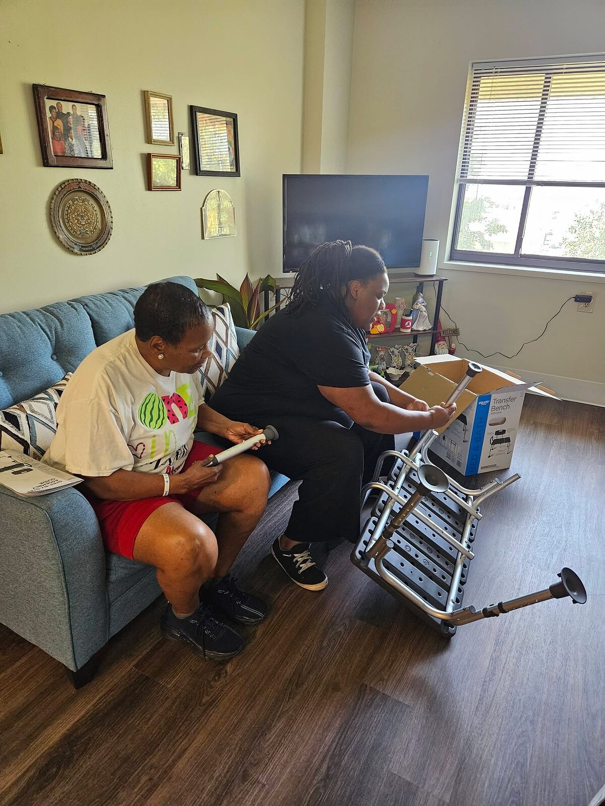 Women’s Ministry volunteers assembling helpful equipment in a home