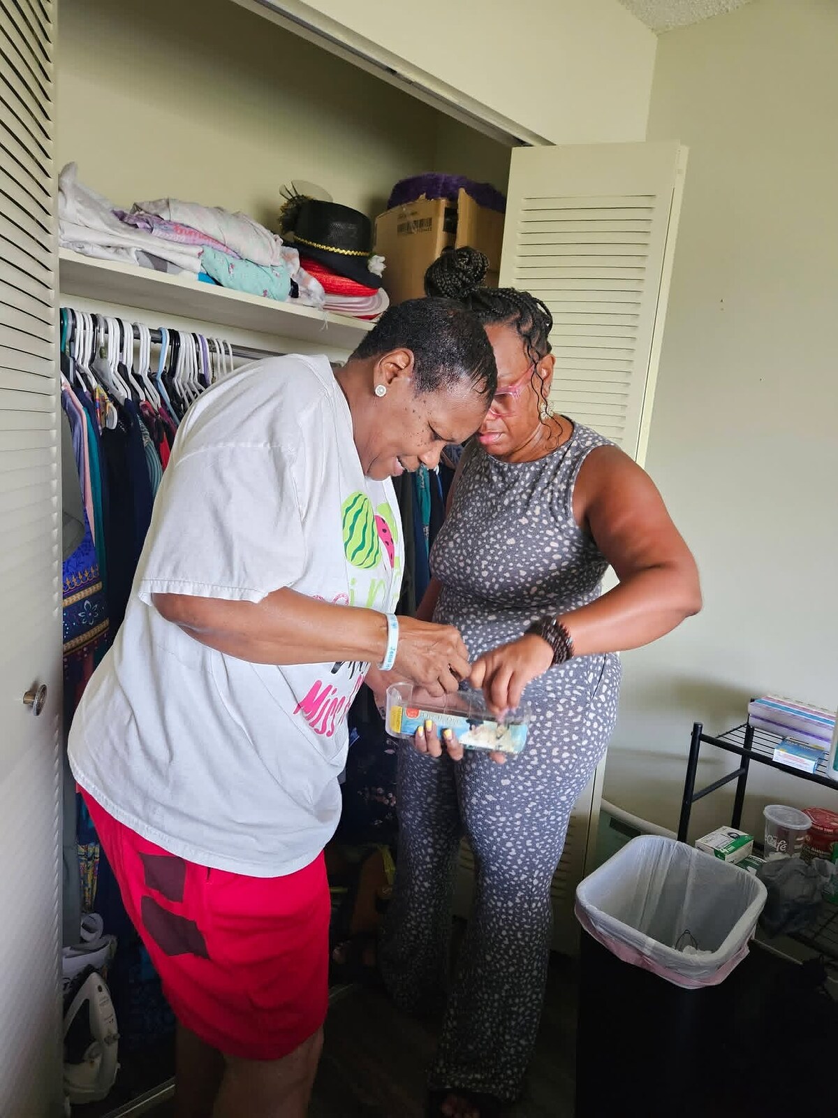 Women’s Ministry volunteers organizing clothing together