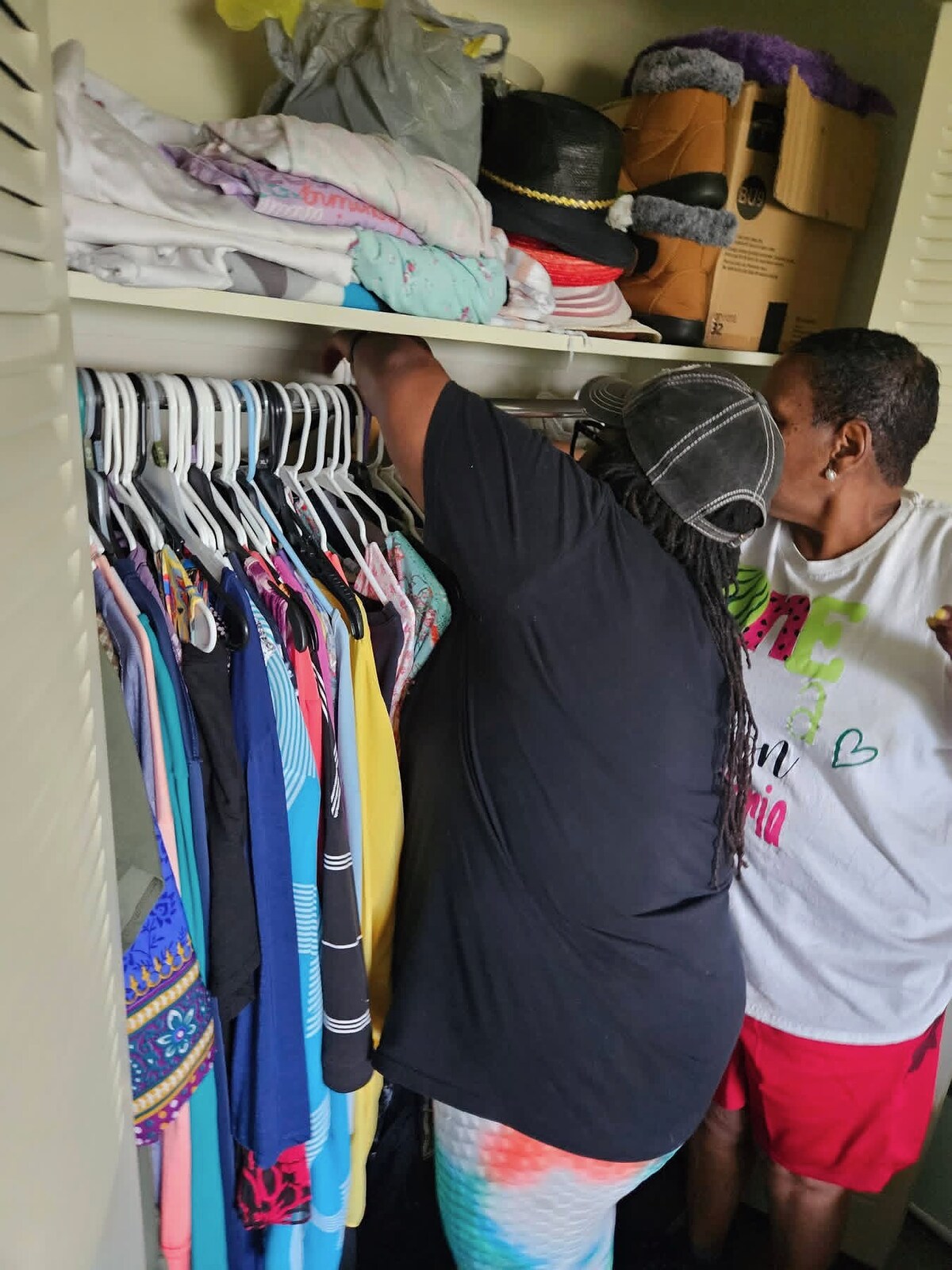 Women’s Ministry volunteers preparing donated clothing